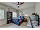 Bedroom with two windows, carpeted floors, and a ceiling fan with lighting at 3163 Neal Ct, Cumming, GA 30041