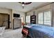 Bedroom with a ceiling fan, carpeted floors, and a large dresser at 3163 Neal Ct, Cumming, GA 30041