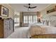 Spacious bedroom featuring plush carpet, a ceiling fan, and natural light creating a serene and inviting atmosphere at 3163 Neal Ct, Cumming, GA 30041
