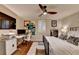This bedroom features a dedicated workspace, ceiling fan, and comfortable sleeping area at 3163 Neal Ct, Cumming, GA 30041