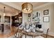 Well-appointed dining area with a large table, elegant décor, and seamless access to the kitchen at 3163 Neal Ct, Cumming, GA 30041