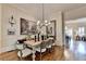 Inviting dining room featuring a wooden table, upholstered chairs and neutral color palette at 3163 Neal Ct, Cumming, GA 30041