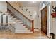 Elegant foyer with hardwood flooring, staircase, and a stylish wooden front door at 3163 Neal Ct, Cumming, GA 30041