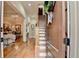 Warm and inviting foyer featuring hardwood floors, staircase, and a view into the dining room at 3163 Neal Ct, Cumming, GA 30041