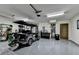 Spacious garage with epoxy flooring, electric golf cart and ample storage and tool space at 3163 Neal Ct, Cumming, GA 30041