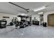 Open and functional garage space with epoxy flooring, showcasing its potential for storage and hobbies at 3163 Neal Ct, Cumming, GA 30041