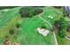 Scenic aerial view of lush golf course with sand traps and undulating fairways at 3163 Neal Ct, Cumming, GA 30041