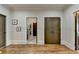 Hallway with multiple doorways and neutral paint, showcasing the home's layout and access to various rooms at 3163 Neal Ct, Cumming, GA 30041