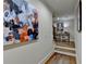 Hallway with staircase and a modern art piece hanging on the wall at 3163 Neal Ct, Cumming, GA 30041