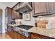 Kitchen featuring stainless steel appliances, gas range, and granite countertops at 3163 Neal Ct, Cumming, GA 30041