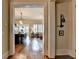 View of open-concept living room and kitchen, hardwood floors, and neutral decor at 3163 Neal Ct, Cumming, GA 30041