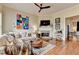 Cozy living room with a fireplace, TV, and comfortable seating, perfect for relaxation and entertainment at 3163 Neal Ct, Cumming, GA 30041