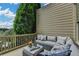 Serene outdoor patio with a comfortable sectional sofa and view, perfect for relaxing and enjoying the scenery at 3163 Neal Ct, Cumming, GA 30041