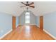 Bonus room features hardwood floors, neutral paint, and window at 3554 Cherry Blossom Court, Loganville, GA 30052