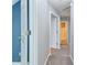 Carpeted hallway featuring white doors and neutral gray paint at 3554 Cherry Blossom Court, Loganville, GA 30052