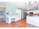 Bright kitchen with stainless steel appliances, white cabinetry, and a built-in desk area at 3554 Cherry Blossom Court, Loganville, GA 30052