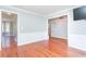 Open living area with hardwood floors, wainscoting, and views into other rooms at 3554 Cherry Blossom Court, Loganville, GA 30052