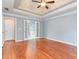 Spacious bedroom with hardwood floors and doors leading to bathroom and closets at 3554 Cherry Blossom Court, Loganville, GA 30052
