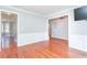 Living room features hardwood floors, wainscoting, and open floorplan at 3554 Cherry Blossom Ct, Loganville, GA 30052