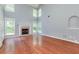 Inviting living room boasts natural light, high ceilings, a fireplace, and neutral paint for a cozy atmosphere at 3554 Cherry Blossom Ct, Loganville, GA 30052