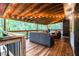 Inviting back deck featuring seating, a wood floor, and string lights, ideal for relaxation at 195 Ansley Ct, Roswell, GA 30076