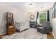 Lovely Bedroom with crib, gray chair, and a bookshelf, perfect for your little one at 195 Ansley Ct, Roswell, GA 30076