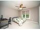 Bedroom featuring a ceiling fan and a desk with computer at 2521 Wood Creek Ct, Dacula, GA 30019