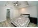 Cozy bedroom features recessed lighting, wood-look floors, and a closet at 2521 Wood Creek Ct, Dacula, GA 30019