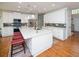 Spacious kitchen with modern white cabinets, a large center island, stainless steel appliances, and sleek subway tile backsplash at 2521 Wood Creek Ct, Dacula, GA 30019