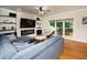Inviting living room showcasing a cozy seating area, fireplace, and an open layout with backyard access at 2521 Wood Creek Ct, Dacula, GA 30019