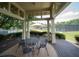 Outdoor patio with elegant wrought iron table and chairs, ideal for relaxing and enjoying the community's green spaces at 2521 Wood Creek Ct, Dacula, GA 30019