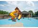 Community playground with slide, swings, and jungle gym providing fun outdoor activities for  at 2521 Wood Creek Ct, Dacula, GA 30019