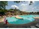 Large community pool with ample lounge seating and clubhouse in the background, great for enjoying hot summer days at 2521 Wood Creek Ct, Dacula, GA 30019