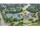 Aerial view of community amenities including tennis courts, clubhouse, pool, and lake access at 2934 Mill Grove Ter, Dacula, GA 30019