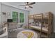 Cozy bedroom with a bunk bed, desk, and playful decor, perfect for  at 2934 Mill Grove Ter, Dacula, GA 30019