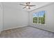 Well-lit bedroom featuring a ceiling fan and double windows at 2934 Mill Grove Ter, Dacula, GA 30019