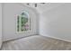 Cozy bedroom with large window and neutral carpeting at 2934 Mill Grove Ter, Dacula, GA 30019