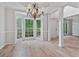 Bright dining room featuring bay window, hardwood floors, and chandelier at 2934 Mill Grove Ter, Dacula, GA 30019
