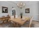 Elegant dining room with a chandelier, modern decor, and ample space for entertaining at 2934 Mill Grove Ter, Dacula, GA 30019