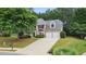 Charming brick home with a two-car garage, mature trees, and a long driveway at 2934 Mill Grove Ter, Dacula, GA 30019