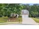 Charming brick home with a two-car garage, manicured lawn, and mature trees in a desirable neighborhood at 2934 Mill Grove Ter, Dacula, GA 30019