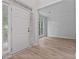 Bright entryway with hardwood floors, a white front door, and natural light from nearby windows at 2934 Mill Grove Ter, Dacula, GA 30019