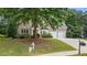 Attractive brick house with a well-maintained lawn and a two-car garage at 2934 Mill Grove Ter, Dacula, GA 30019