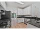 Charming kitchen featuring granite countertops and stainless steel appliances at 2934 Mill Grove Ter, Dacula, GA 30019