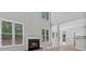 Bright living room with fireplace, hardwood floors, and backyard view at 2934 Mill Grove Ter, Dacula, GA 30019