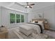 Serene main bedroom with tray ceilings, large windows, and neutral decor at 2934 Mill Grove Ter, Dacula, GA 30019