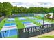 The community has pickleball courts with blue and gray surfaces and green borders at 2934 Mill Grove Ter, Dacula, GA 30019