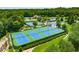 A view of the community tennis courts, surrounded by lush greenery at 2934 Mill Grove Ter, Dacula, GA 30019