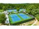 Community tennis courts surrounded by trees and lush grass at 2934 Mill Grove Ter, Dacula, GA 30019