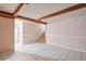Open unfinished basement with tiled floors, neutral walls, and exposed ceiling beams at 3812 Clare Ct, Duluth, GA 30096